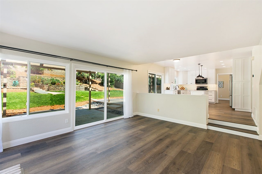 519 Gardendale Road Encinitas, CA 92024 - Photo 5 of 25 a view of a living room hardwood floor and a kitchen