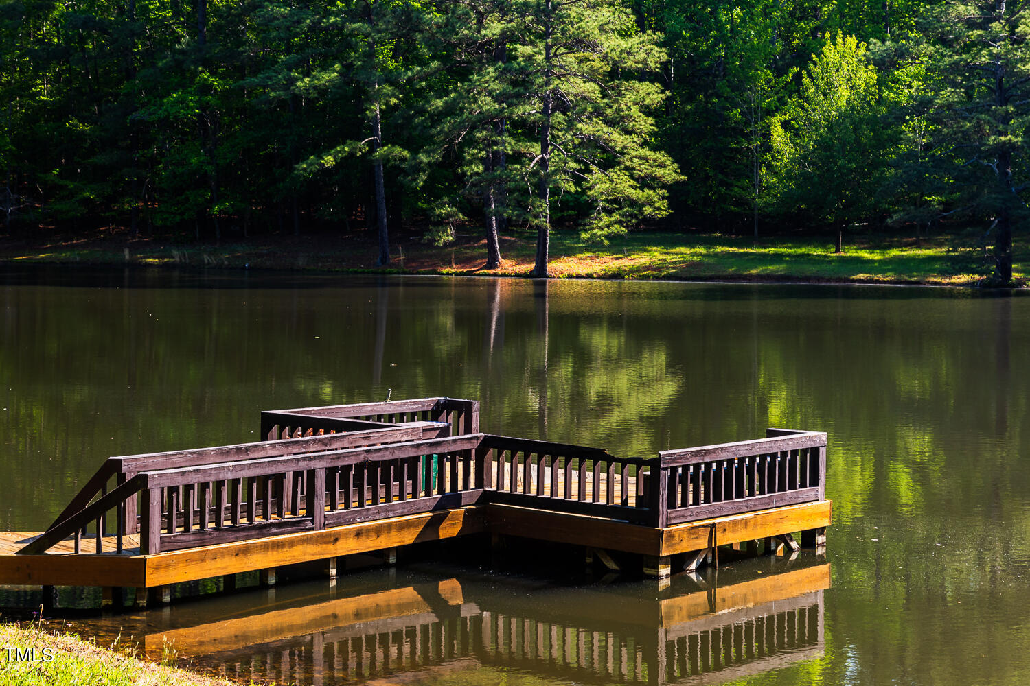 10305 Old Creedmoor Road Raleigh, NC 27613 - Photo 12 of 63 a view of a roof deck with lake view and wooden floor
