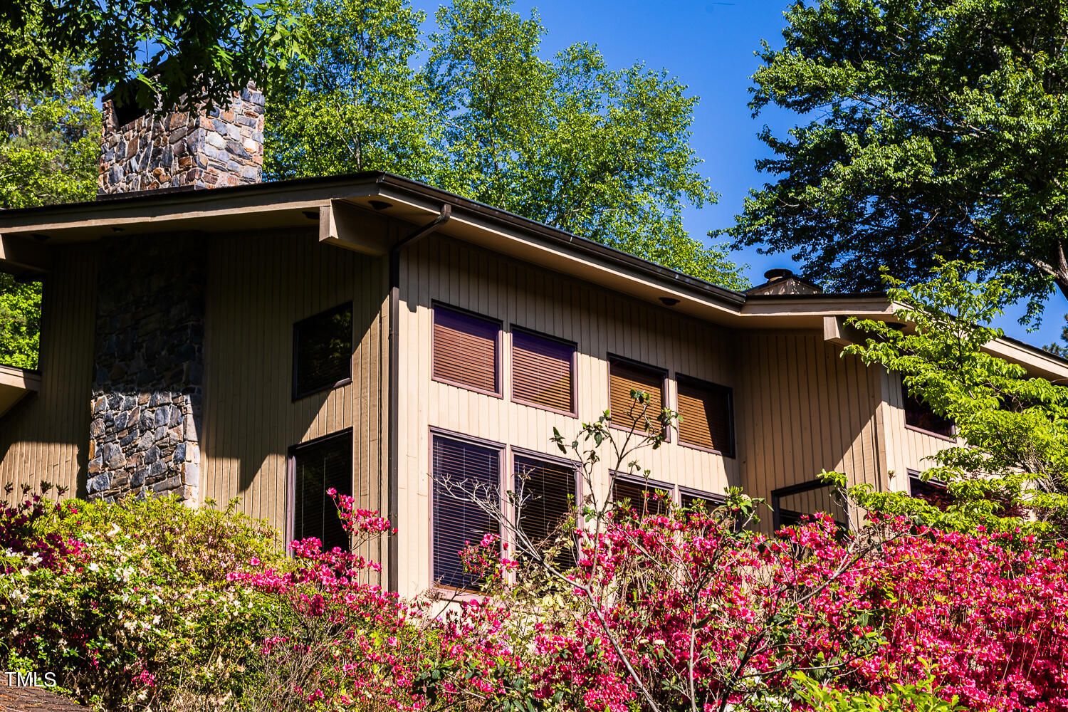 10305 Old Creedmoor Road Raleigh, NC 27613 - Photo 14 of 63 a view of a house with a flower garden