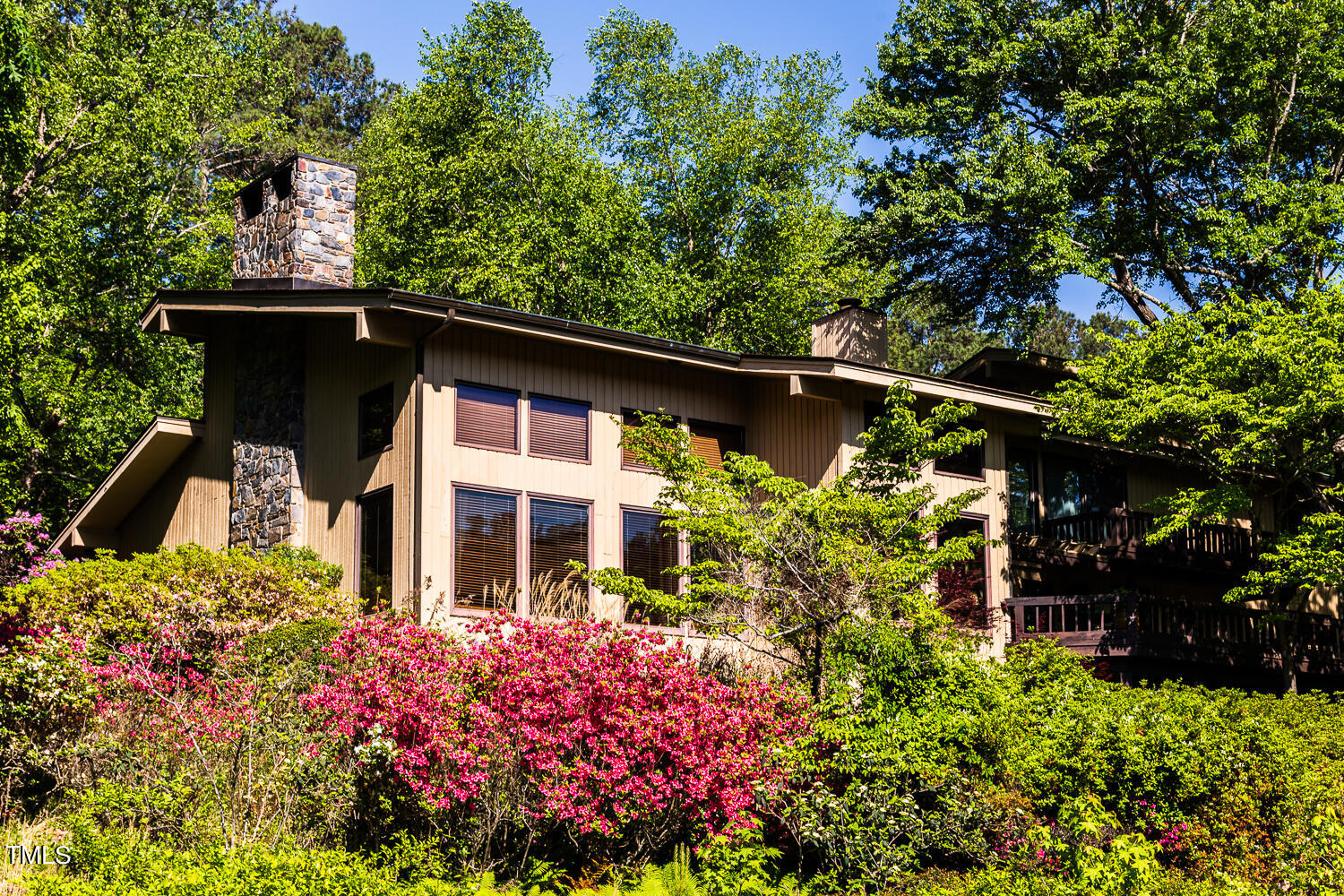 10305 Old Creedmoor Road Raleigh, NC 27613 - Photo 16 of 63 front view of a house with a flower garden