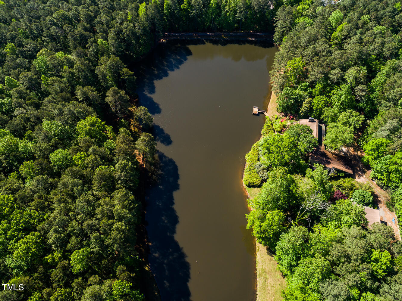 10305 Old Creedmoor Road Raleigh, NC 27613 - Photo 28 of 63 an aerial view of a house with a yard and lake view