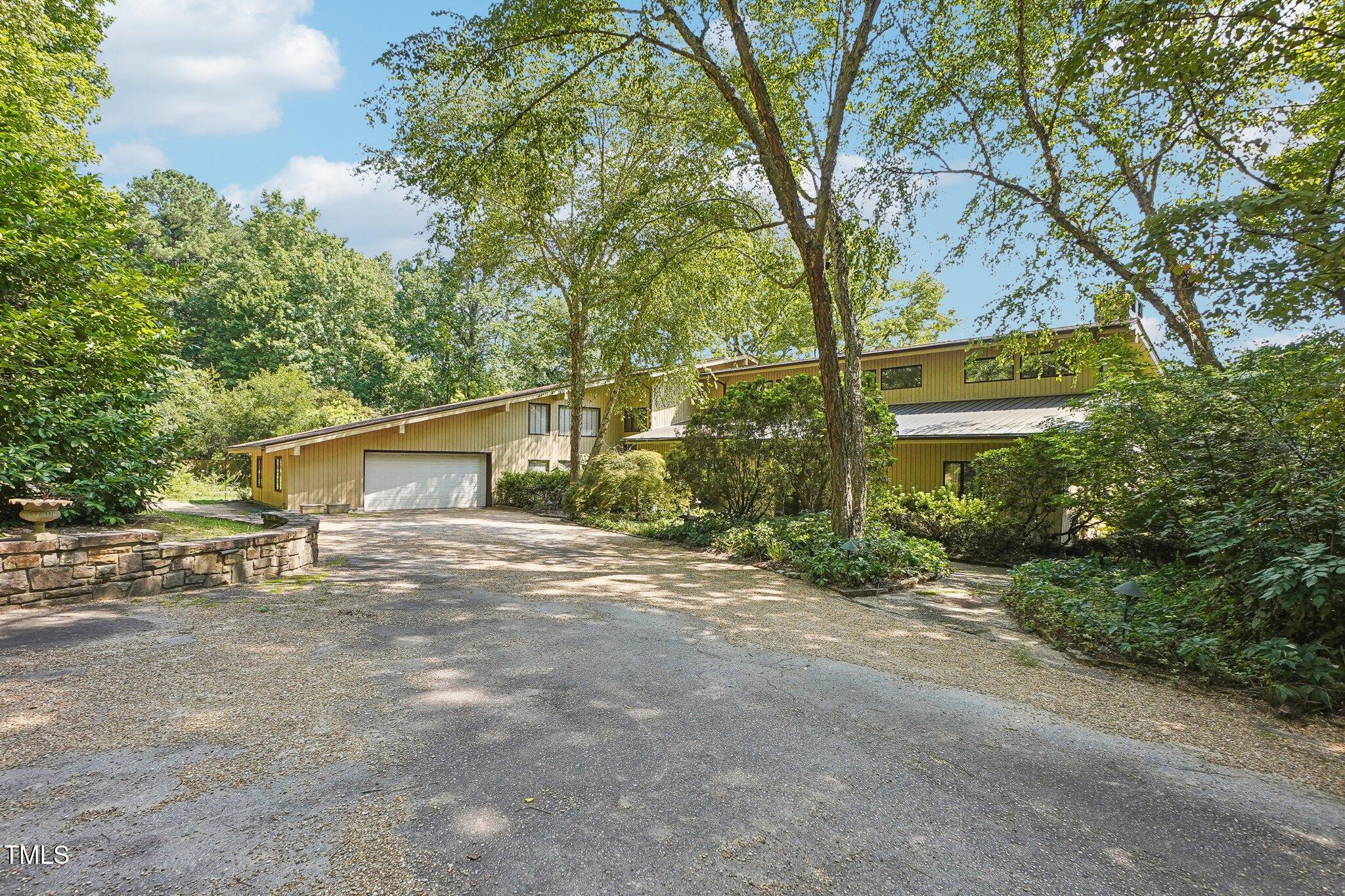 10305 Old Creedmoor Road Raleigh, NC 27613 - Photo 36 of 63 a view of a house with a street