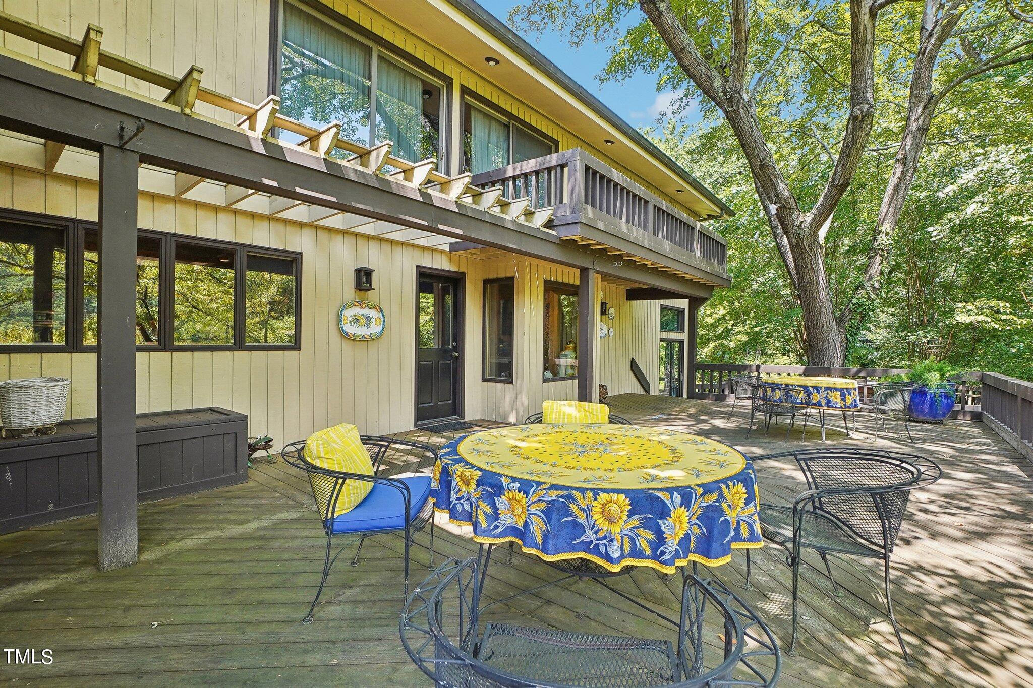 10305 Old Creedmoor Road Raleigh, NC 27613 - Photo 57 of 63 a view of a chairs and table in the patio