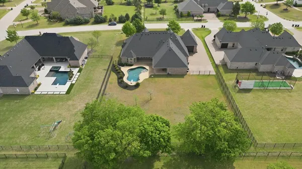 an aerial view of a house with swimming pool