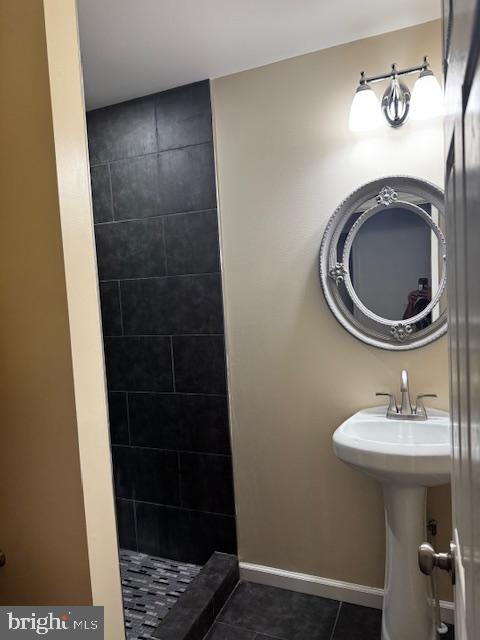 1339 West Lafayette Avenue, Unit 1 Baltimore, MD 21217 - Photo 12 of 24 a bathroom with a sink and a mirror