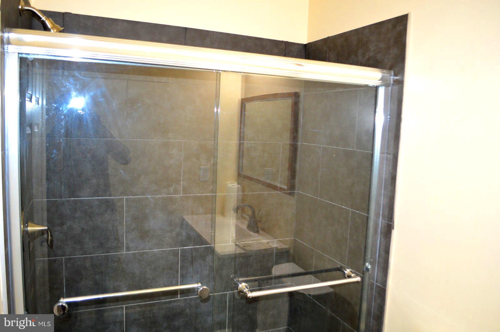 1339 West Lafayette Avenue, Unit 1 Baltimore, MD 21217 - Photo 19 of 24 a bathroom with a shower