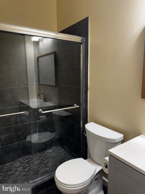 1339 West Lafayette Avenue, Unit 1 Baltimore, MD 21217 - Photo 20 of 24 a white toilet sitting next to a shower