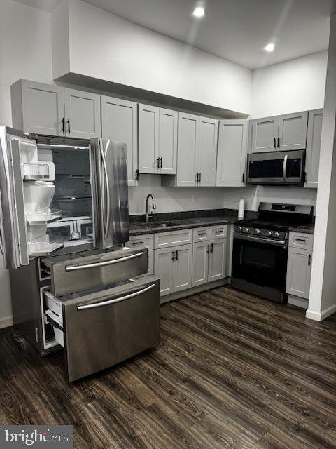 1339 West Lafayette Avenue, Unit 1 Baltimore, MD 21217 - Photo 9 of 24 a kitchen with stainless steel appliances granite countertop a stove a sink and a refrigerator