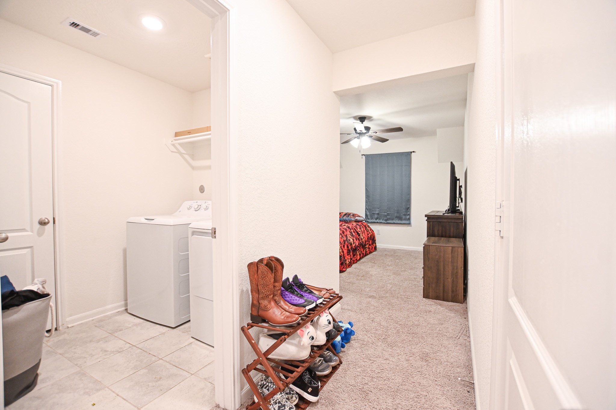 5920 Bluebonnet Lane Rosenberg, TX 77469 - Photo 7 of 24 Hallway leading to the flex room, to the left a spacious utility room