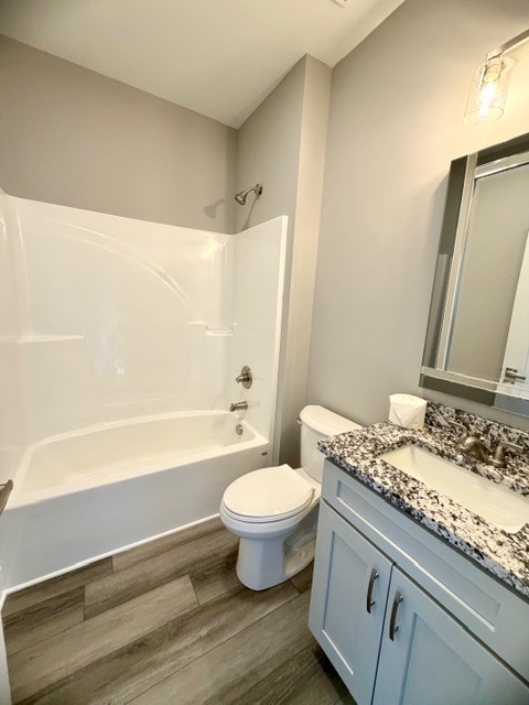 6421 Lynchburg Road Winchester, TN 37398 - Photo 17 of 25 a bathroom with a granite countertop sink a toilet and a bathtub