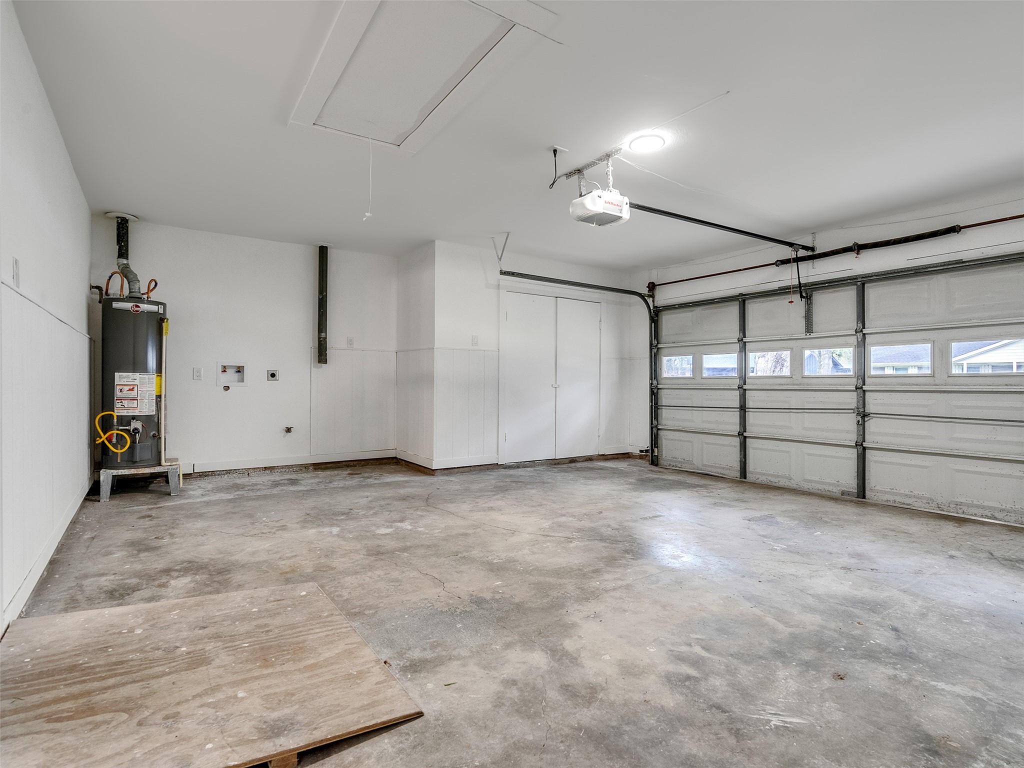 10315 Winding Trail Road La Porte, TX 77571 - Photo 18 of 24 Discover the perfect blend of convenience and space in this expansive two-car garage, complete with washer and dryer connections for all your home needs.