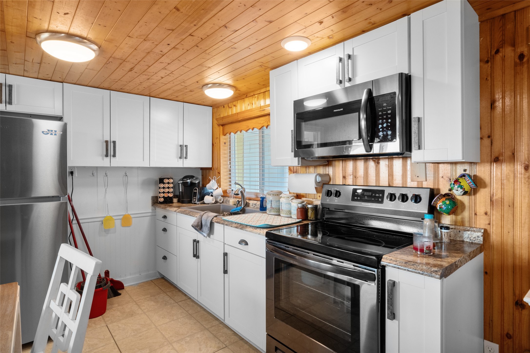 3130 Fm-2031 Matagorda, TX 77457 - Photo 11 of 25 a kitchen with stainless steel appliances a stove a sink and a microwave