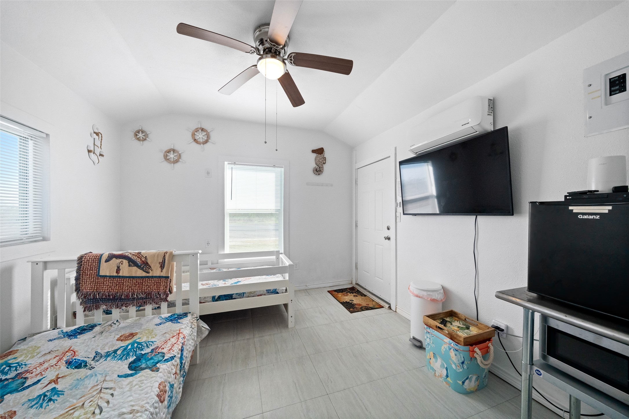 3130 Fm-2031 Matagorda, TX 77457 - Photo 20 of 25 a bedroom with furniture and a flat screen tv