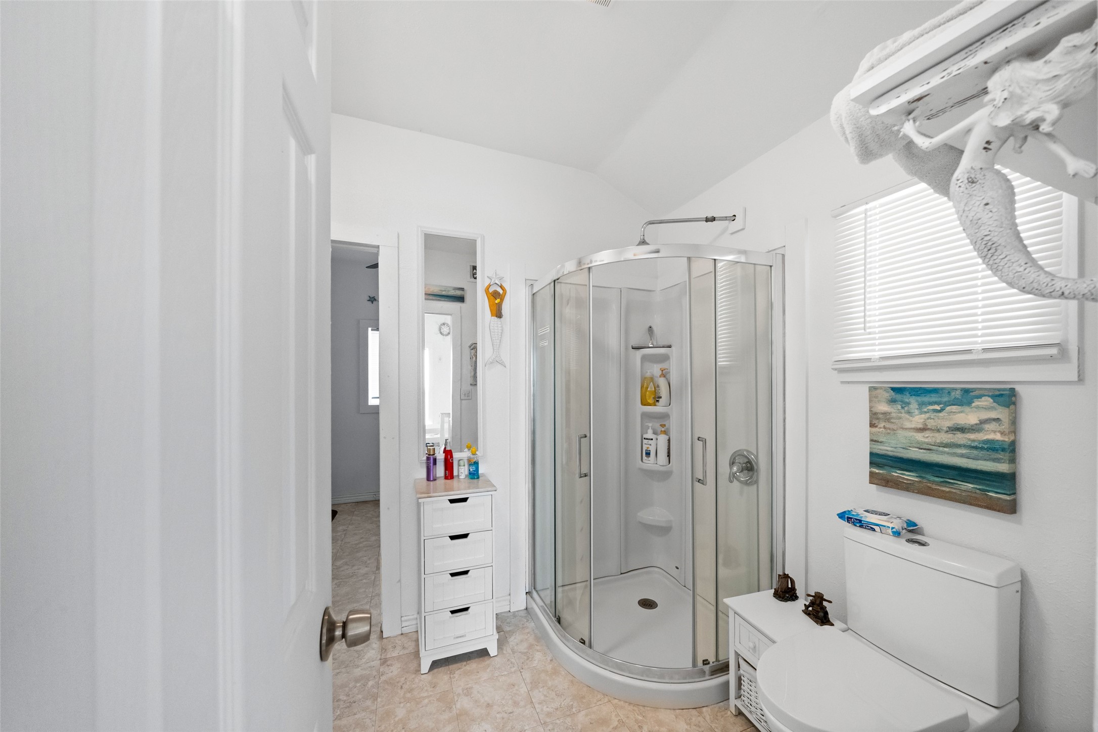 3130 Fm-2031 Matagorda, TX 77457 - Photo 23 of 25 a bathroom with a granite countertop toilet sink and shower