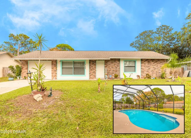 a view of a house with swimming pool and sitting area