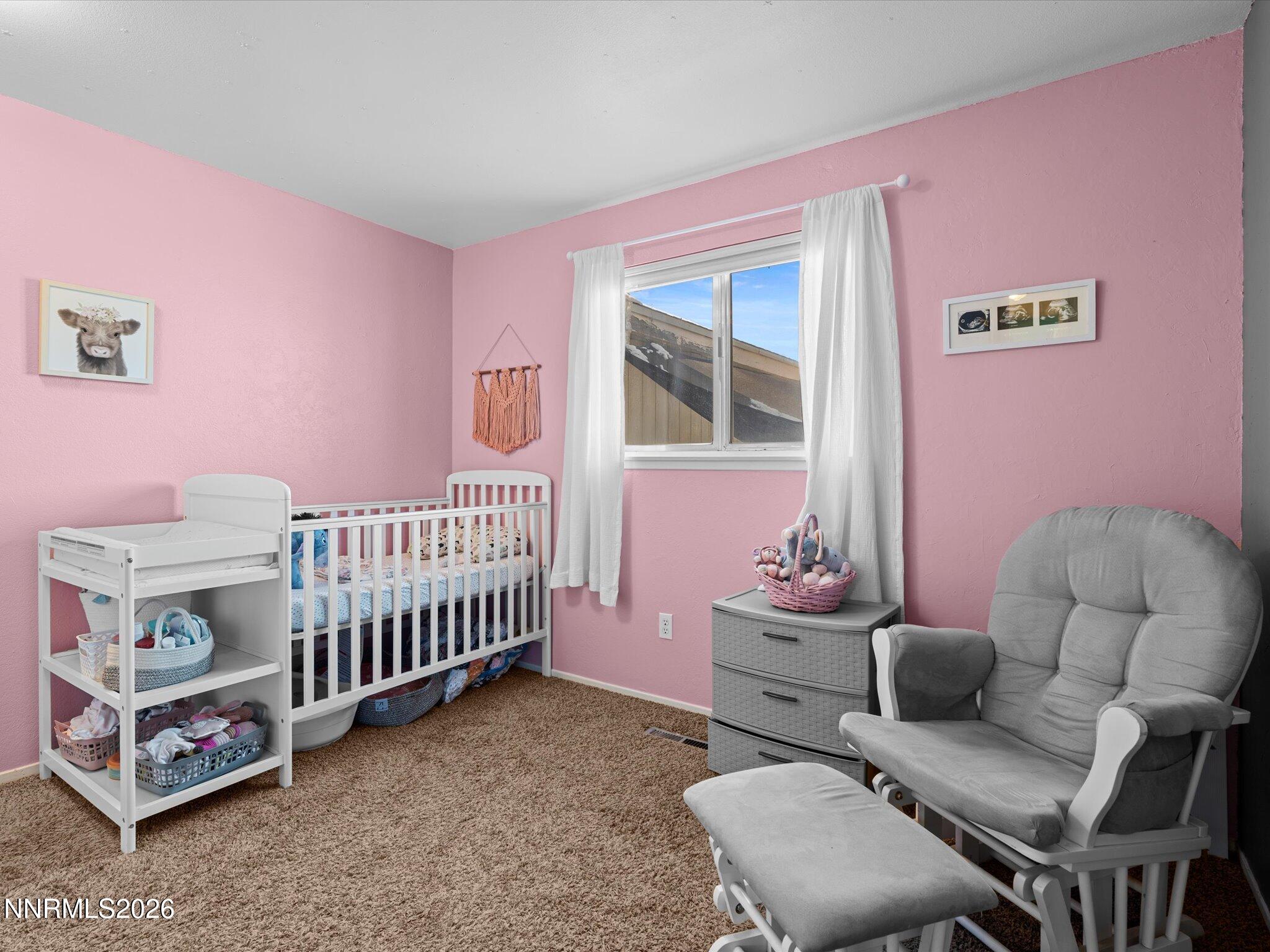 151 Roughing It Road Dayton, NV 89403 - Photo 15 of 25 a bedroom with furniture and a window