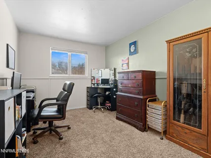 a view of a workspace with furniture