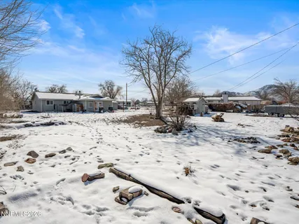 a view of yard covered in snow