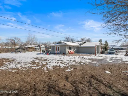 a view of house with a yard