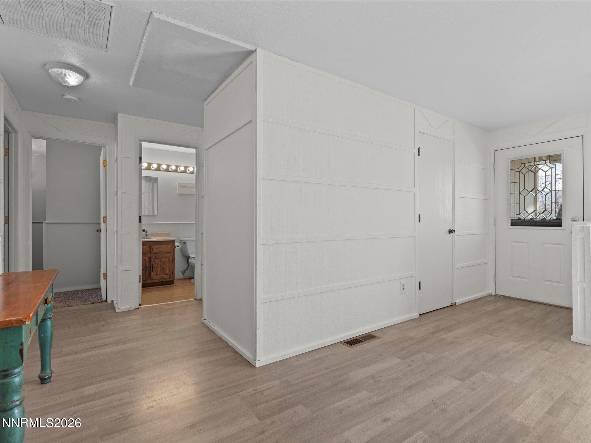 151 Roughing It Road Dayton, NV 89403 - Photo 2 of 25 a view of empty room with wooden floor