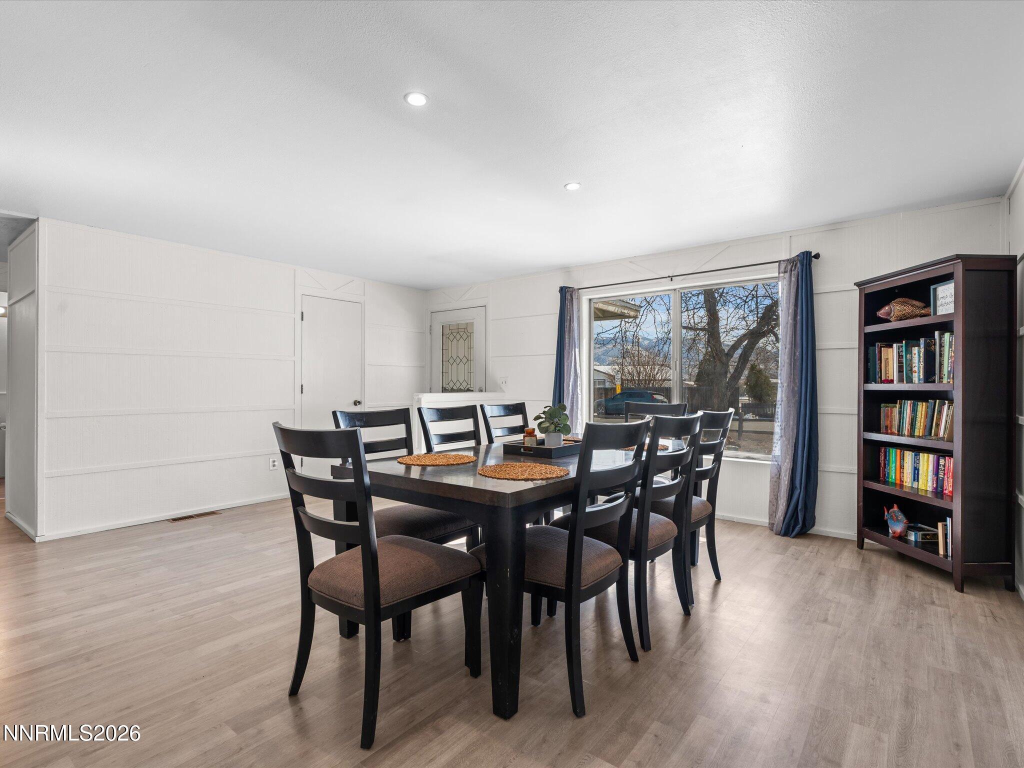 151 Roughing It Road Dayton, NV 89403 - Photo 4 of 25 a view of a dining room with furniture and wooden floor