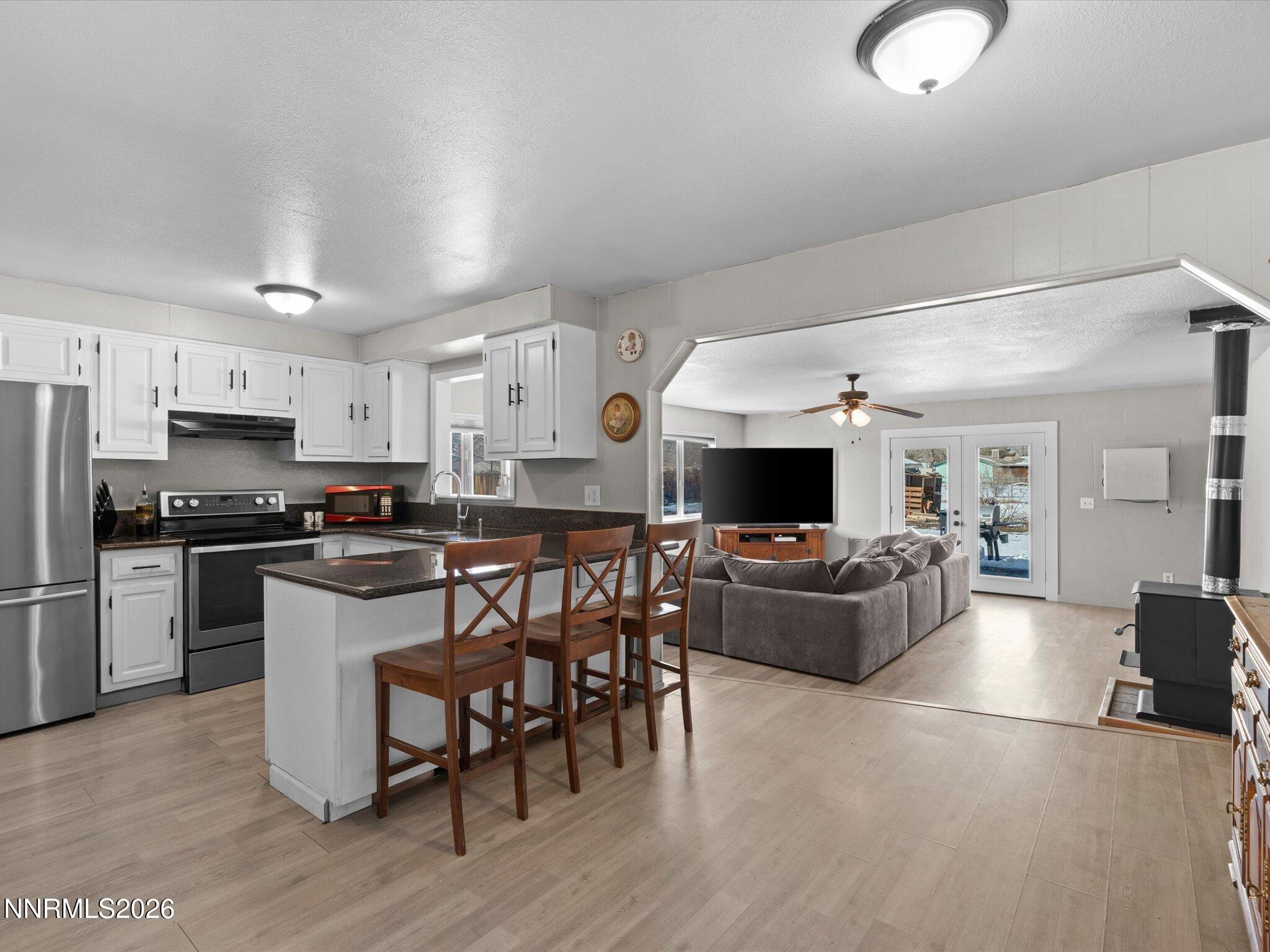 151 Roughing It Road Dayton, NV 89403 - Photo 5 of 25 a living room with furniture and a fireplace