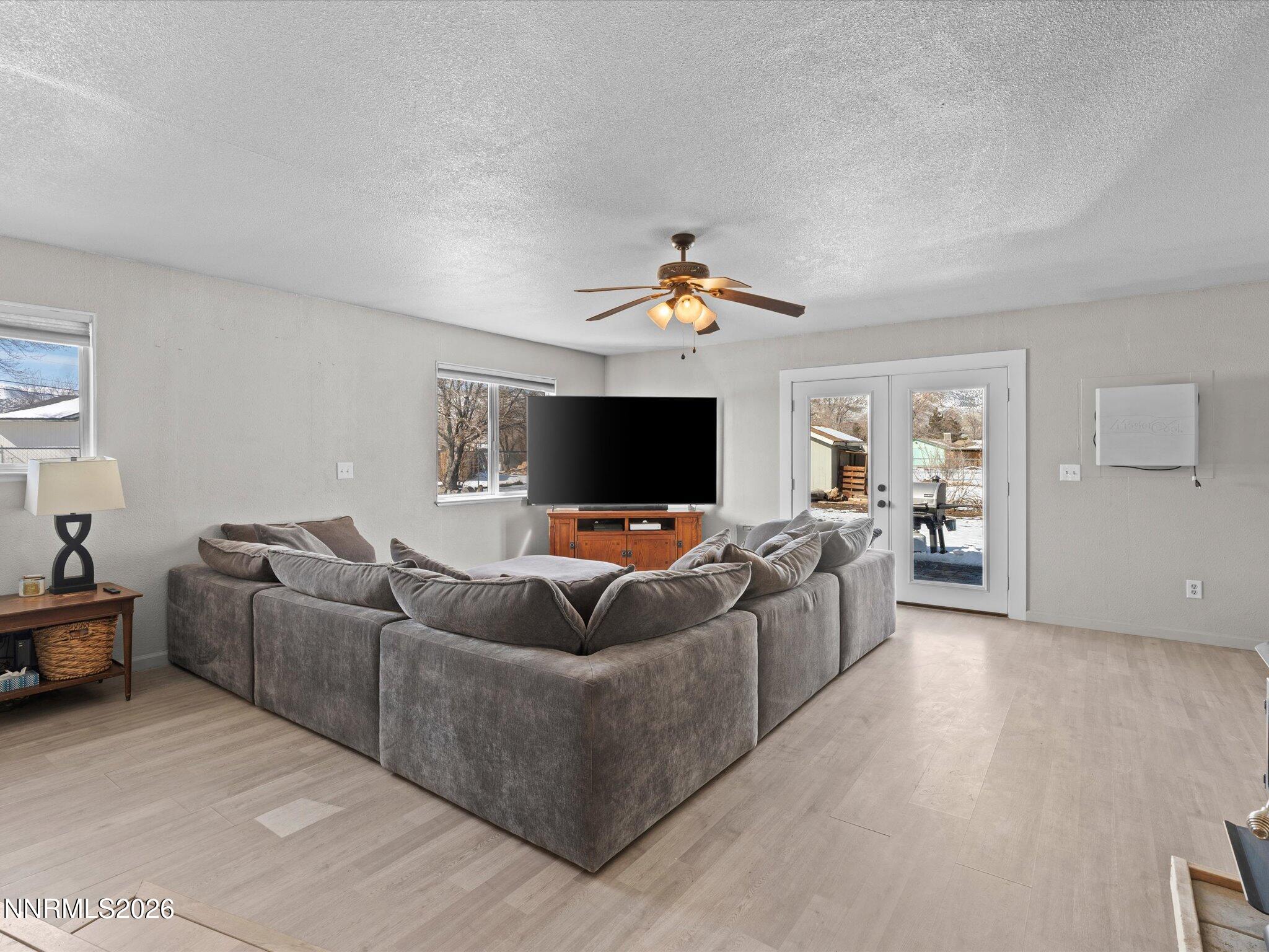 151 Roughing It Road Dayton, NV 89403 - Photo 9 of 25 a living room with furniture and a flat screen tv