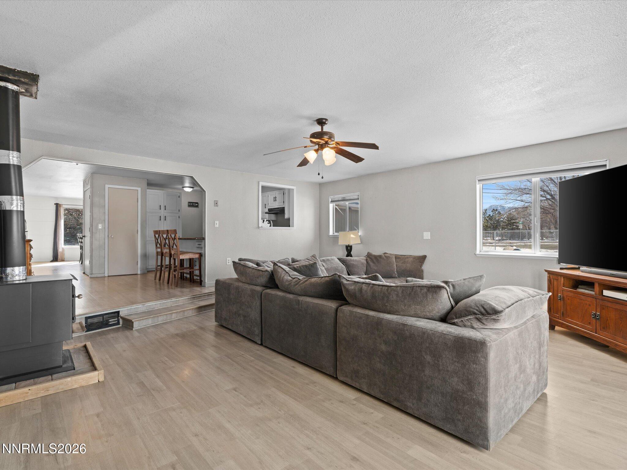 151 Roughing It Road Dayton, NV 89403 - Photo 10 of 25 a living room with furniture and a flat screen tv
