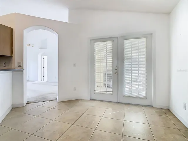 an aerial view of residential house with parking and yard