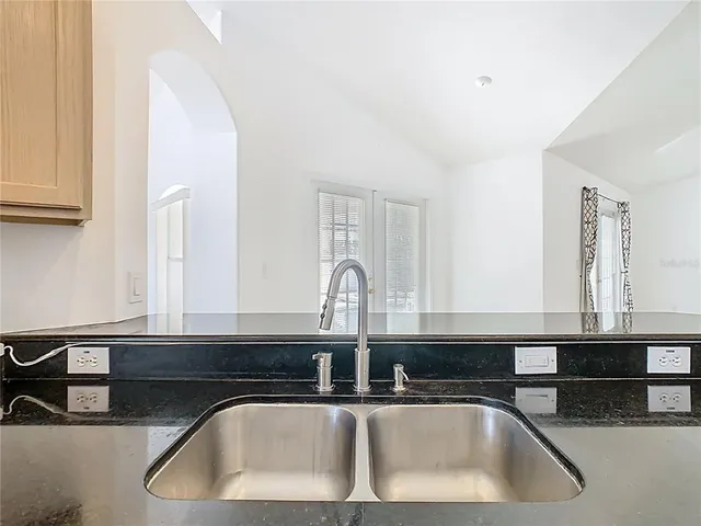 a view of a swimming pool in back of house