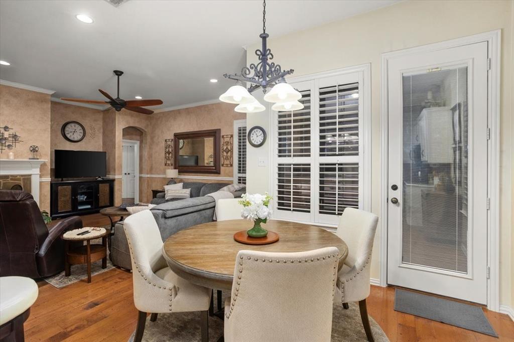 8312 Teja Trail Benbrook, TX 76126 - Photo 11 of 23 a view of a dining room with furniture window and wooden floor