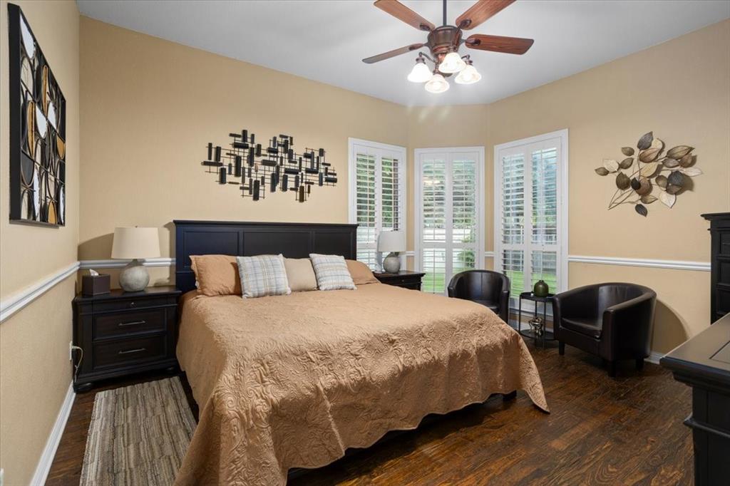 8312 Teja Trail Benbrook, TX 76126 - Photo 13 of 23 a bedroom with a large bed and a chandelier