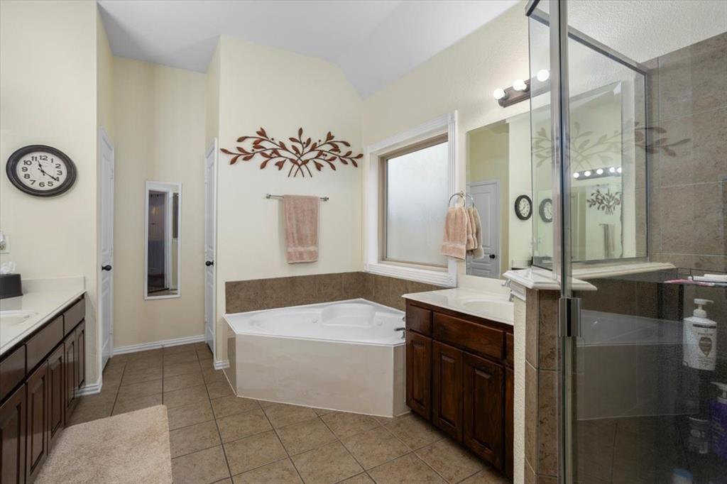 8312 Teja Trail Benbrook, TX 76126 - Photo 14 of 23 a bathroom with a tub sink and mirror