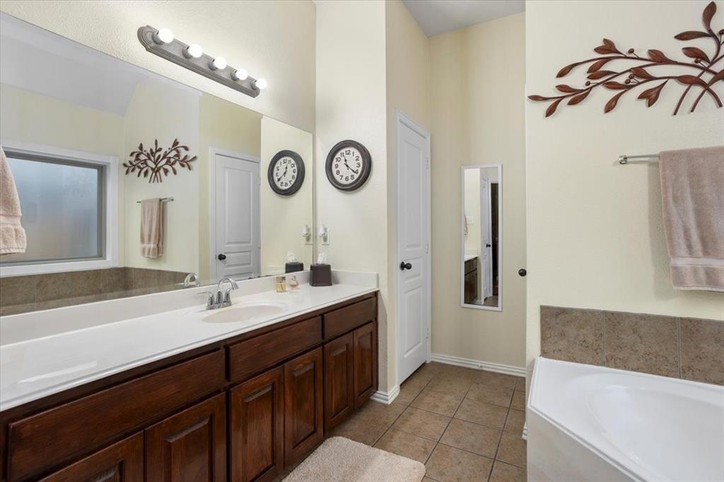 8312 Teja Trail Benbrook, TX 76126 - Photo 15 of 23 a spacious bathroom with a double vanity sink and a mirror