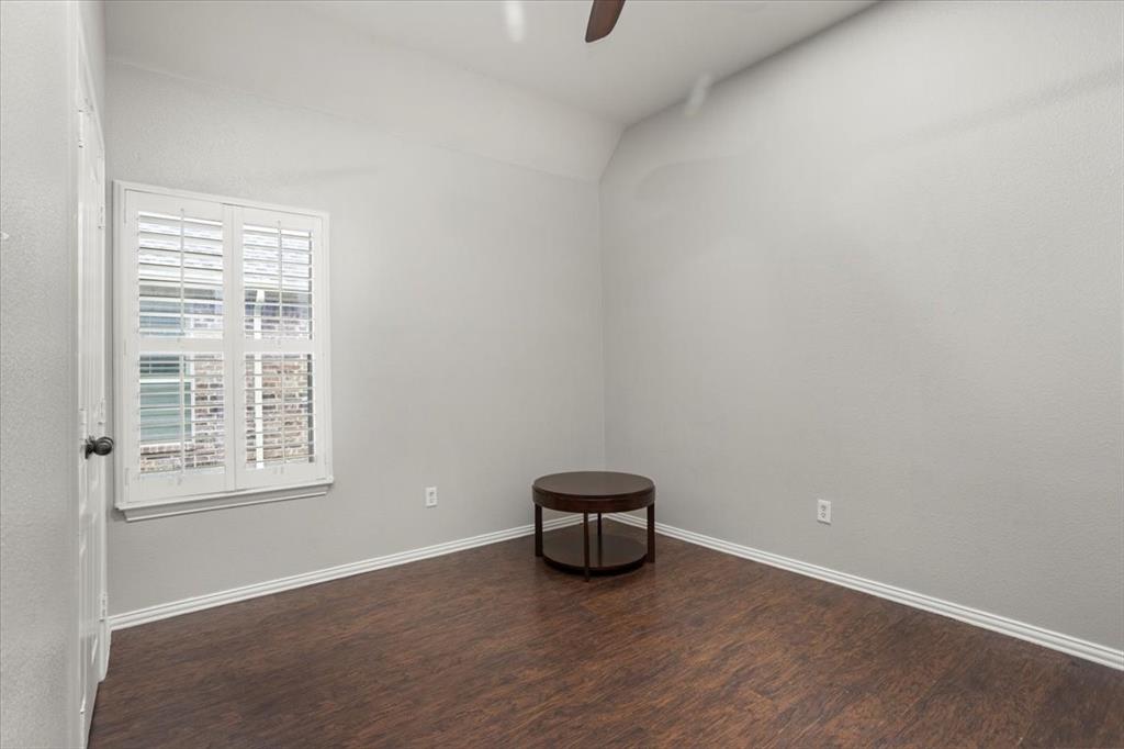 8312 Teja Trail Benbrook, TX 76126 - Photo 18 of 23 a view of an empty room with a window and wooden floor