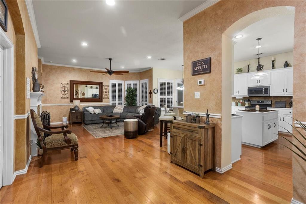 8312 Teja Trail Benbrook, TX 76126 - Photo 3 of 23 a living room with furniture wooden floor and kitchen view