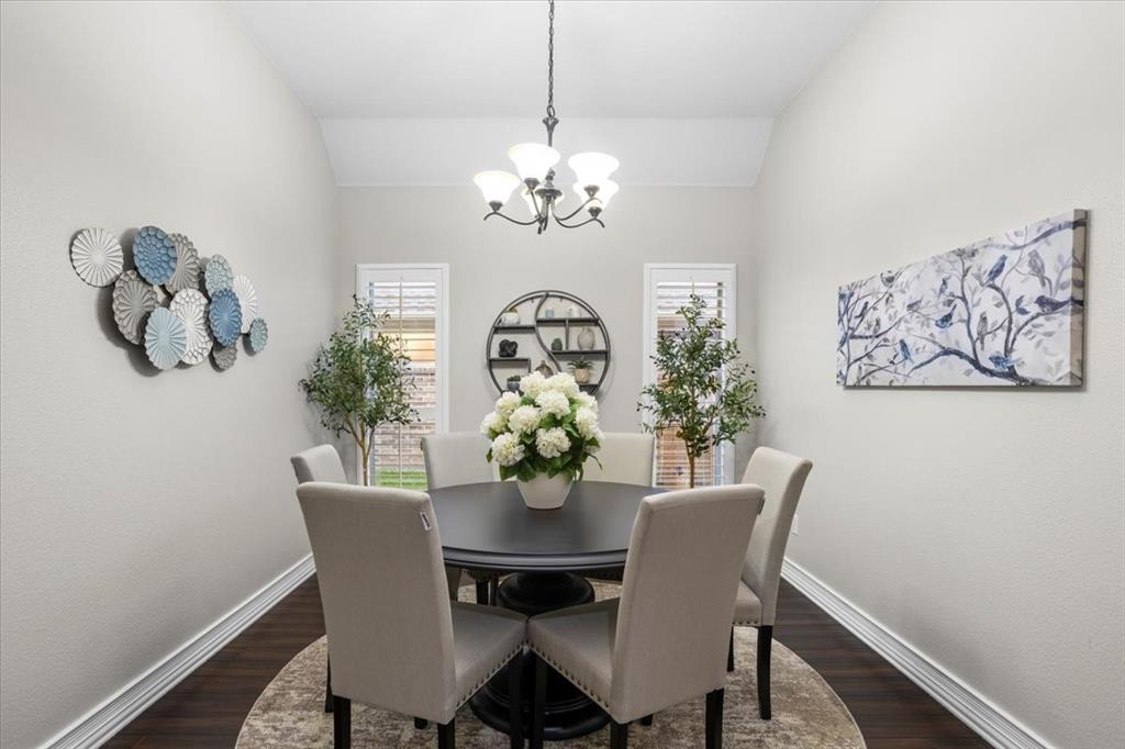 8312 Teja Trail Benbrook, TX 76126 - Photo 10 of 23 a view of a dining room with furniture chandelier and wooden floor