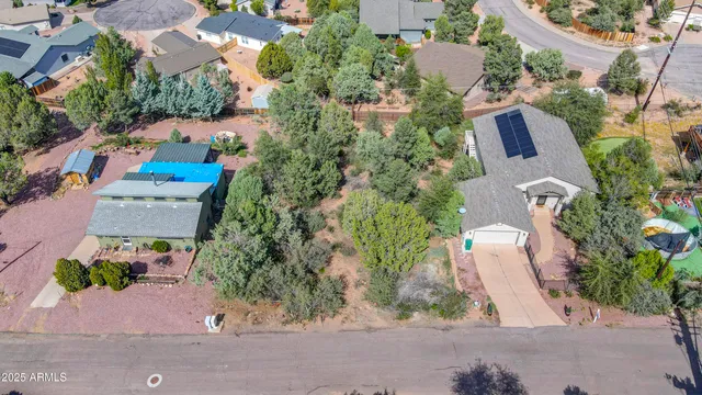 an aerial view of house with yard swimming pool and outdoor seating