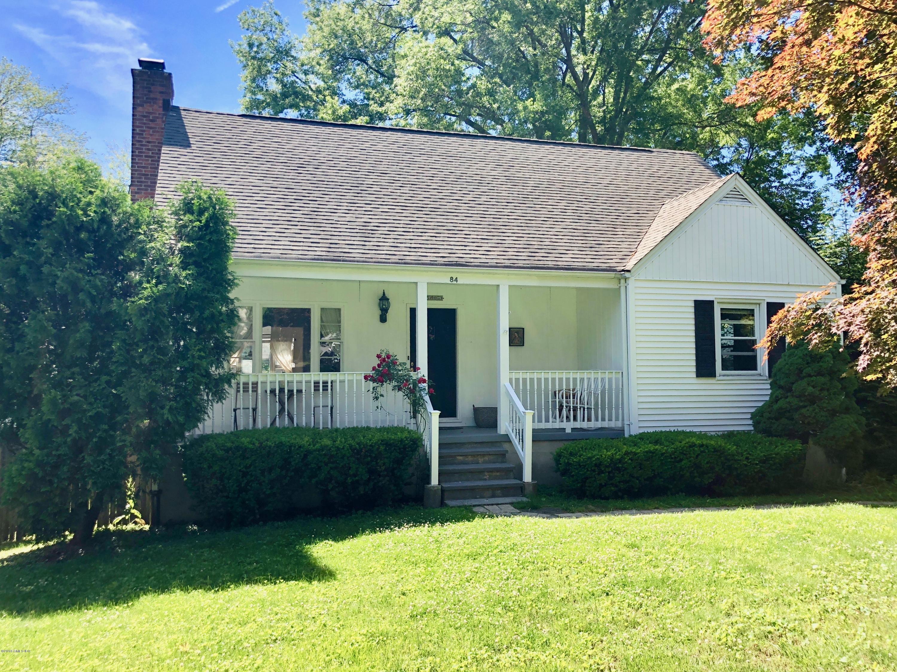 a view of a house with backyard porch and garden
