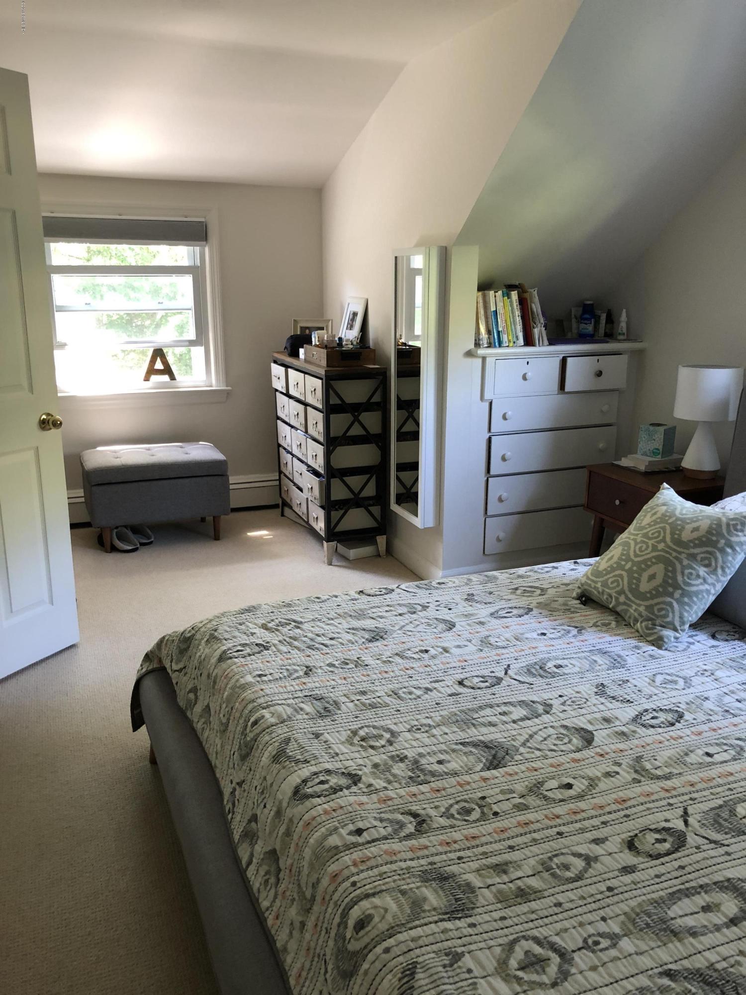 84 Indian Field Road Greenwich, CT 06830 - Photo 13 of 19 a bedroom with a bed and dresser