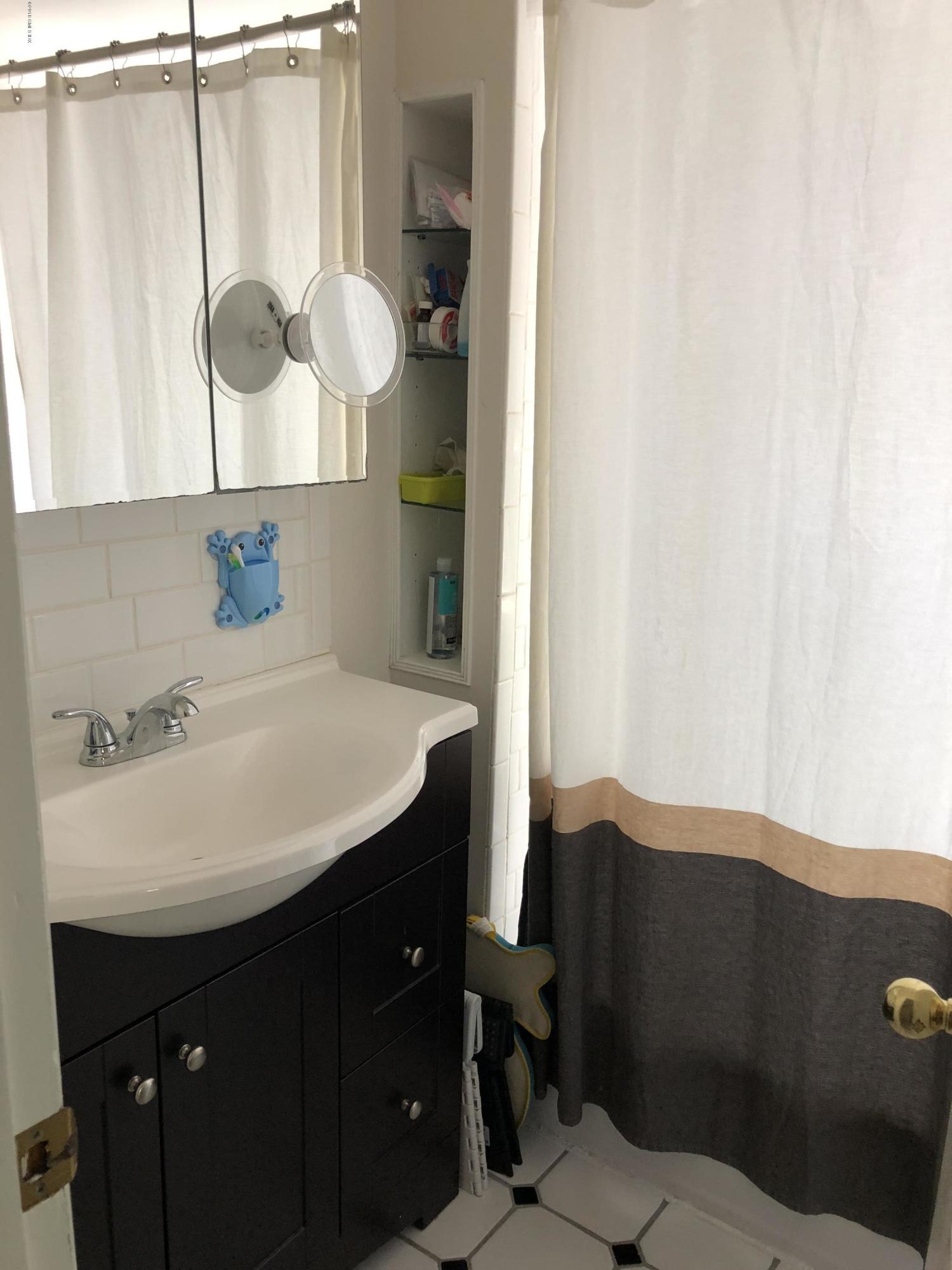 84 Indian Field Road Greenwich, CT 06830 - Photo 14 of 19 a bathroom with a sink vanity and a mirror