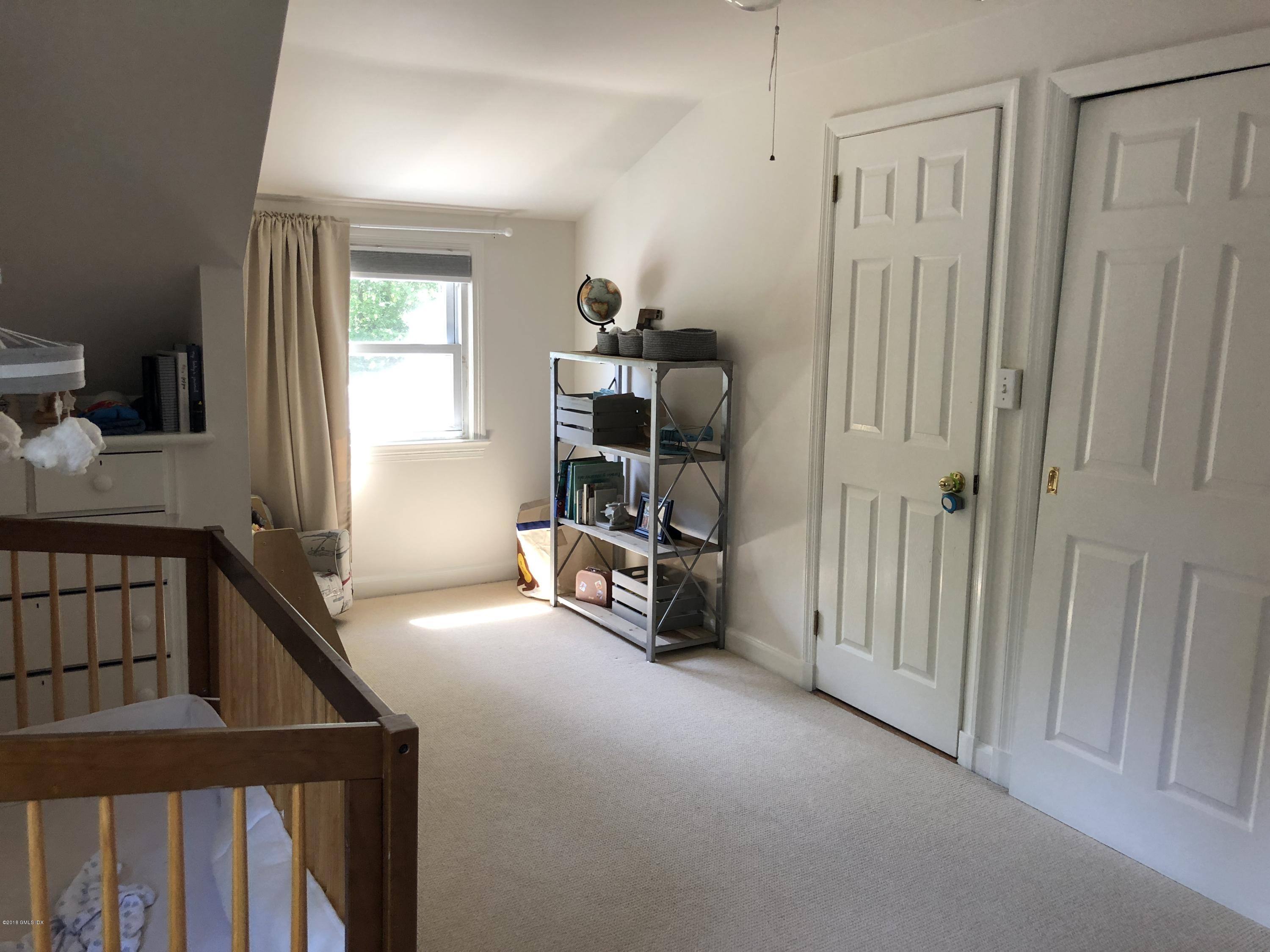 84 Indian Field Road Greenwich, CT 06830 - Photo 16 of 19 a view of a hallway with workspace