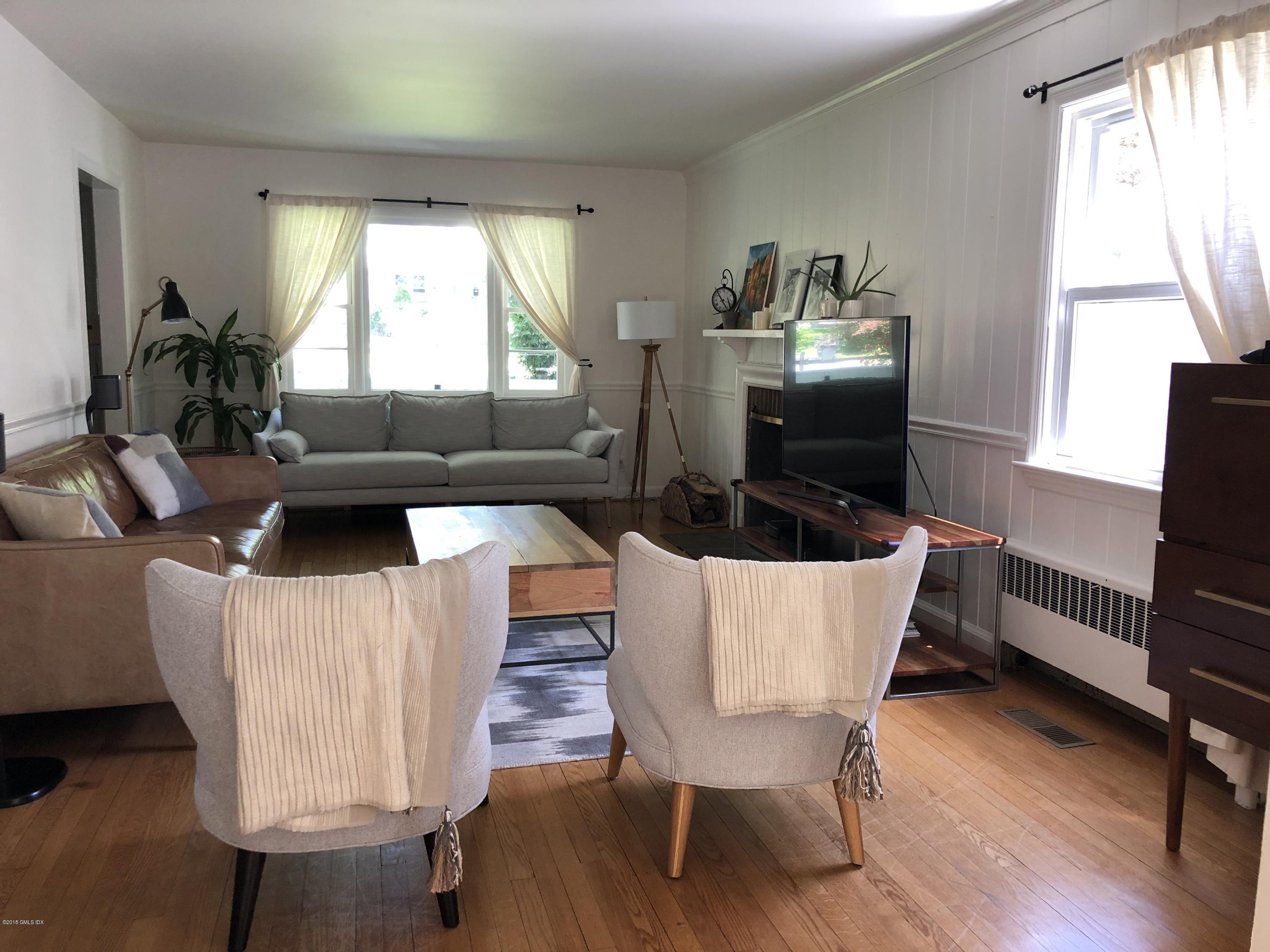 84 Indian Field Road Greenwich, CT 06830 - Photo 4 of 19 a living room with furniture and a window