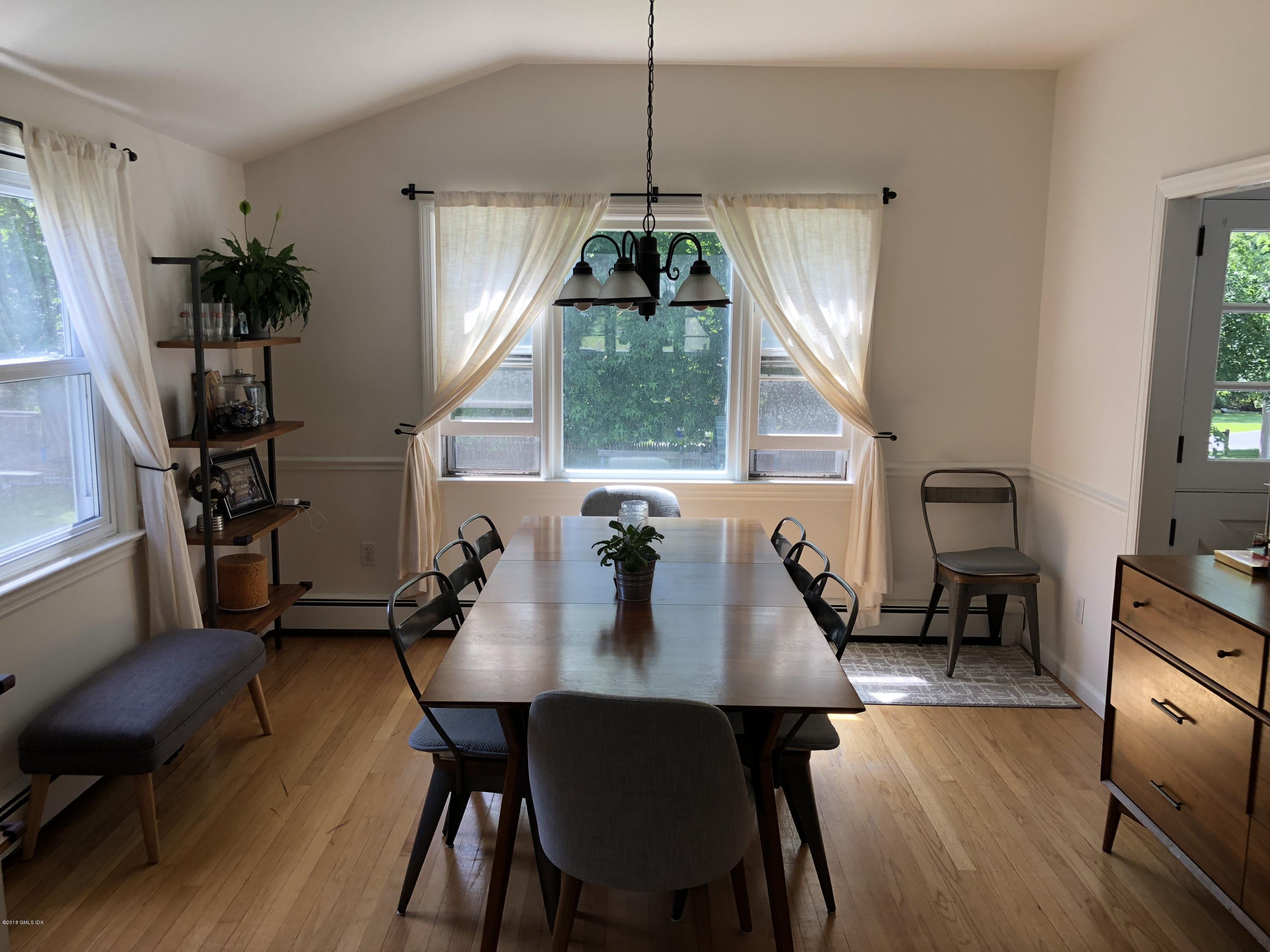 84 Indian Field Road Greenwich, CT 06830 - Photo 5 of 19 a view of a dining room with furniture window and wooden floor