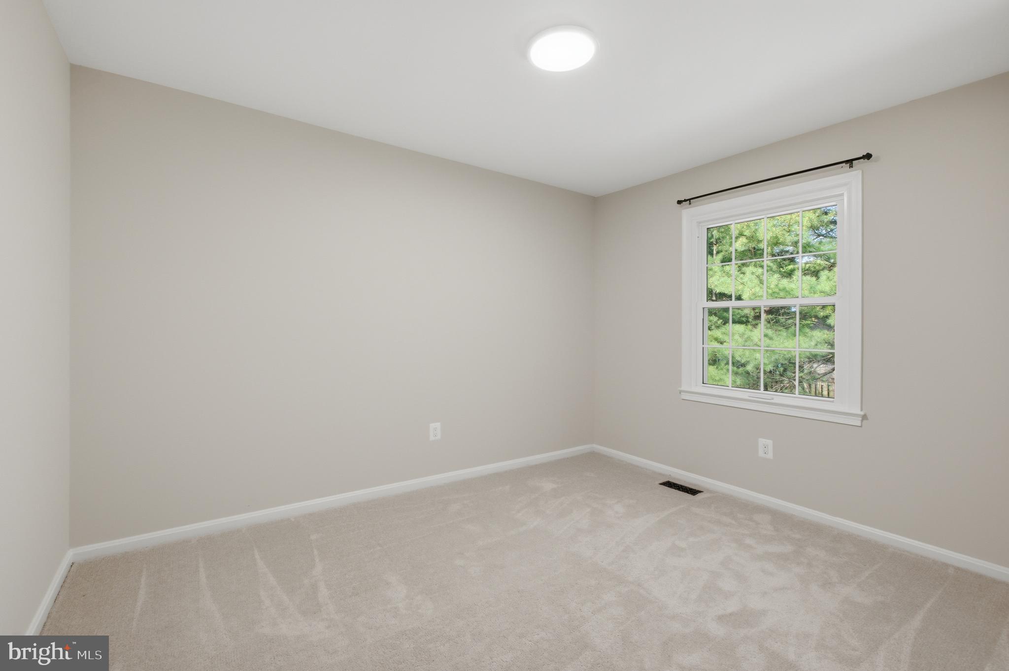 8575 Tyrolean Way Springfield, VA 22153 - Photo 17 of 29 an empty room with a window