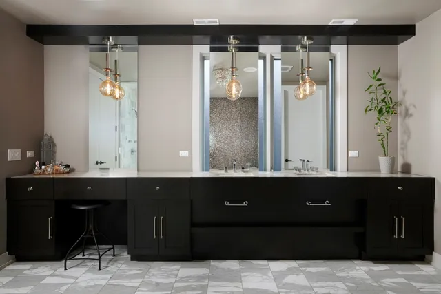 a large bathroom with a double vanity sink and mirror with shower