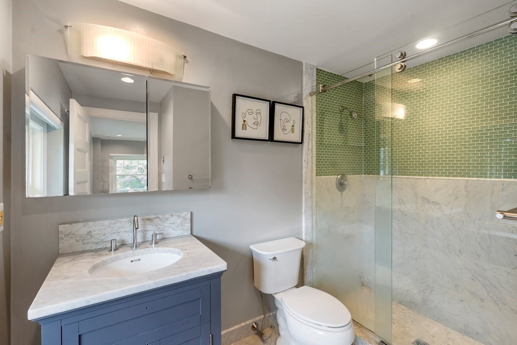 11 Hillside Road Wellesley, MA 02481 - Photo 17 of 29 a bathroom with a sink toilet and shower