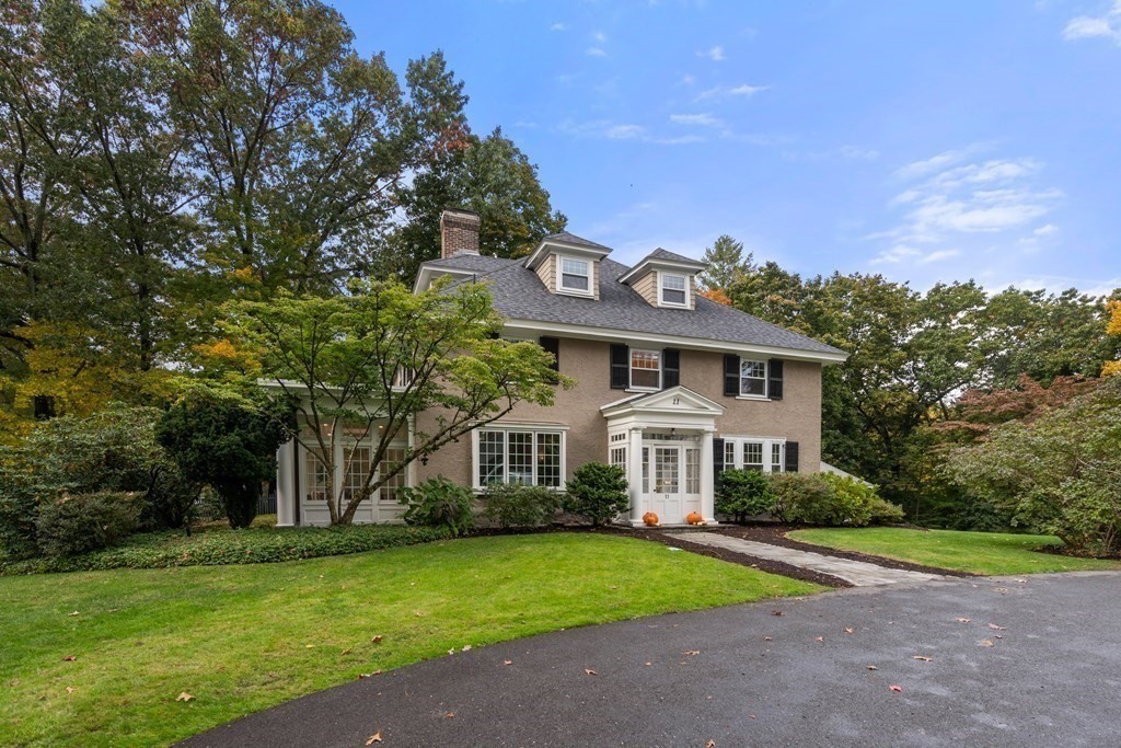11 Hillside Road Wellesley, MA 02481 - Photo 2 of 29 a front view of a house with a yard and garage