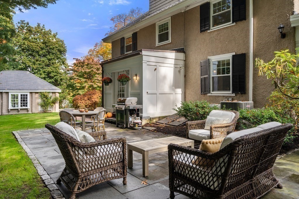 11 Hillside Road Wellesley, MA 02481 - Photo 26 of 29 a view of a patio with couches chairs and a yard