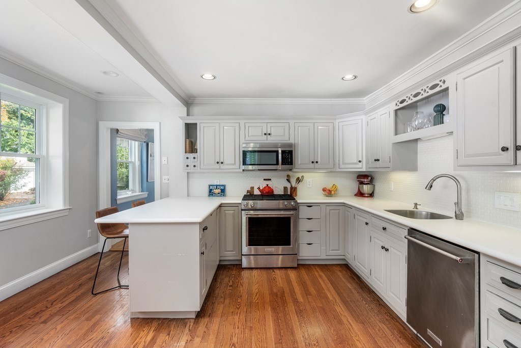 11 Hillside Road Wellesley, MA 02481 - Photo 8 of 29 a kitchen with a sink cabinets a counter top space and stainless steel appliances